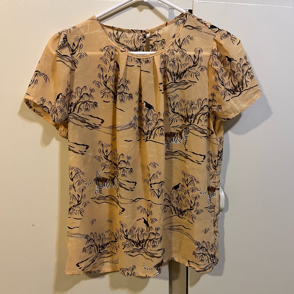 Woman’s safari print blouse.